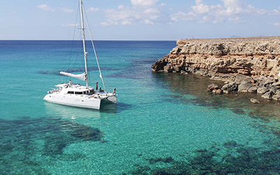 Catamaran on charter in Ibiza visiting the island of Formentera