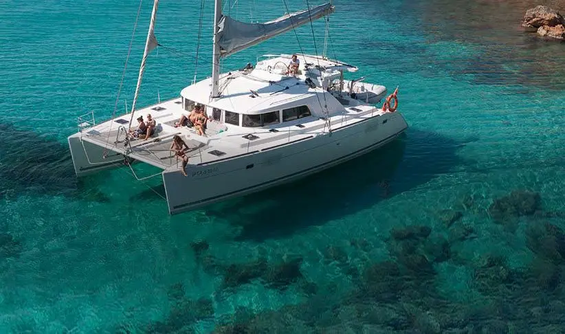 Catamaran in waters near Formentera while on yacht charter in Ibiza 